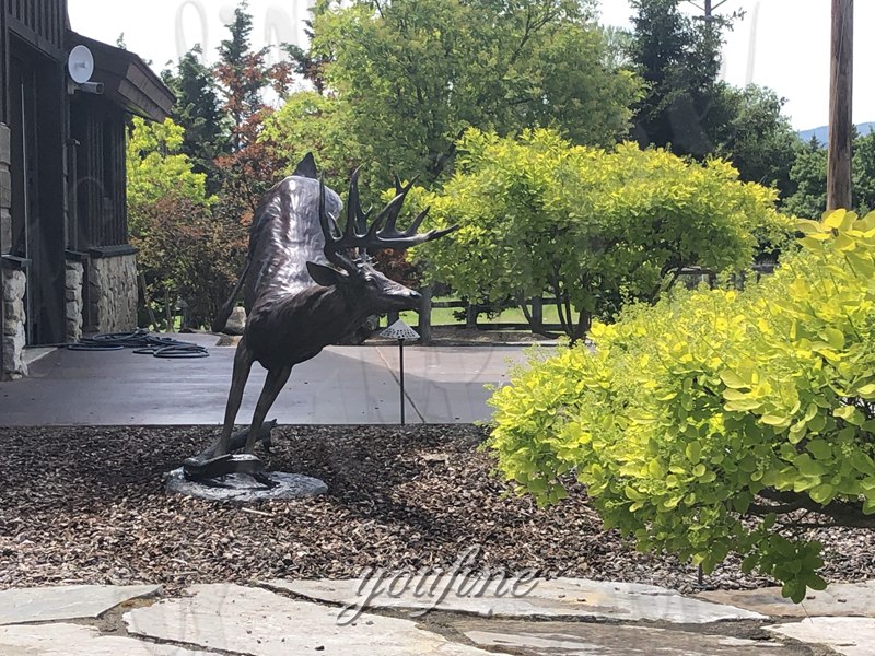 bronze whitetail deer in garden