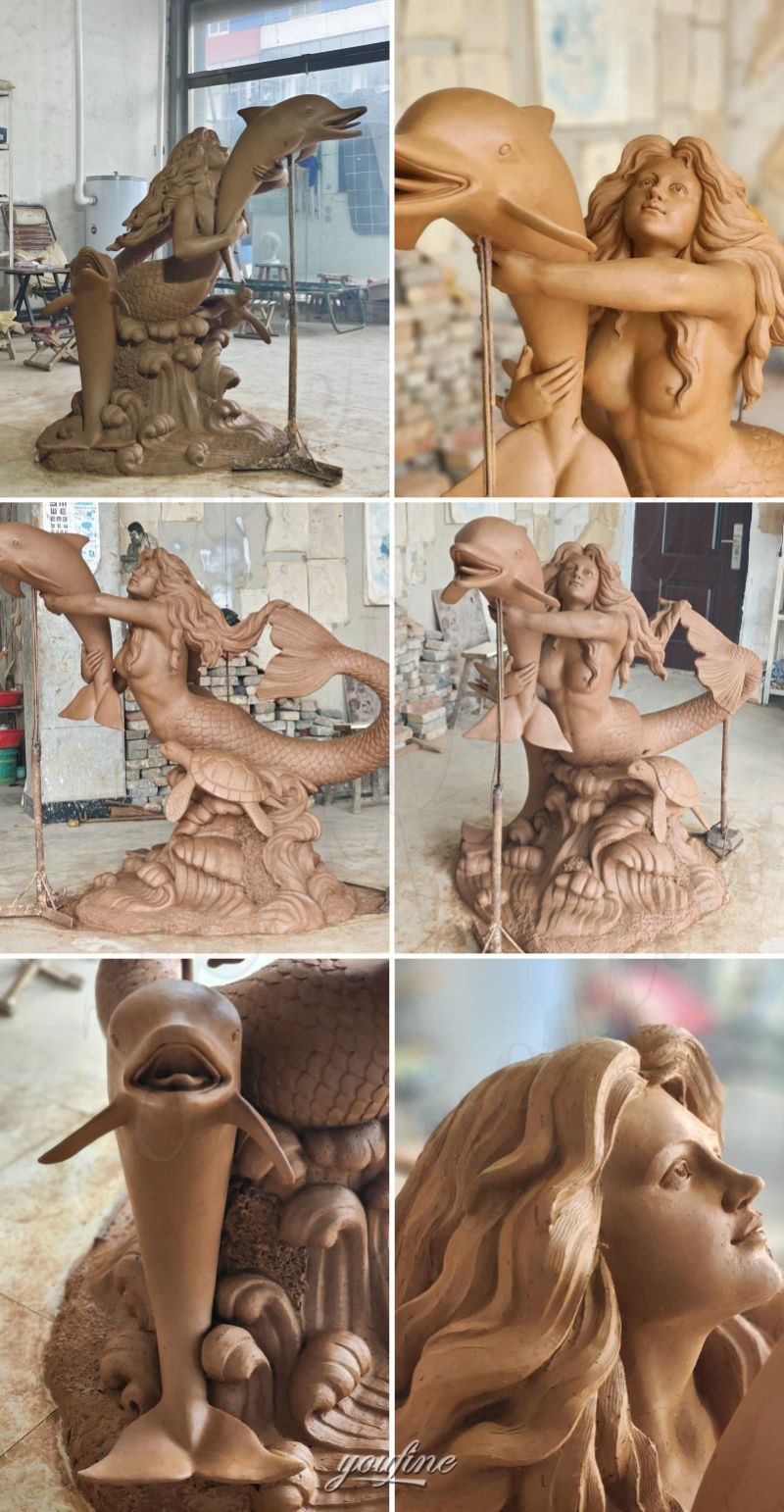 mermaid and dolphin statue clay m