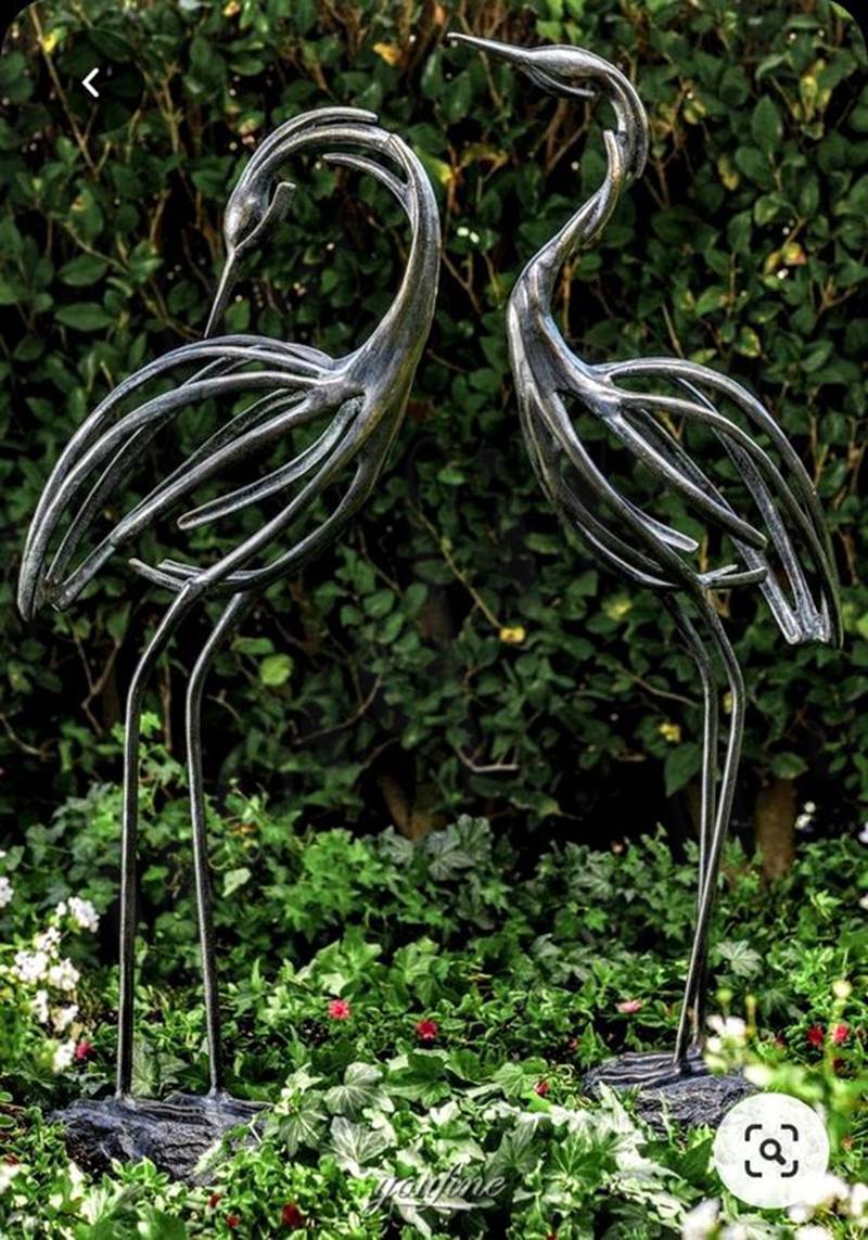 stylized bronze heron sculptures