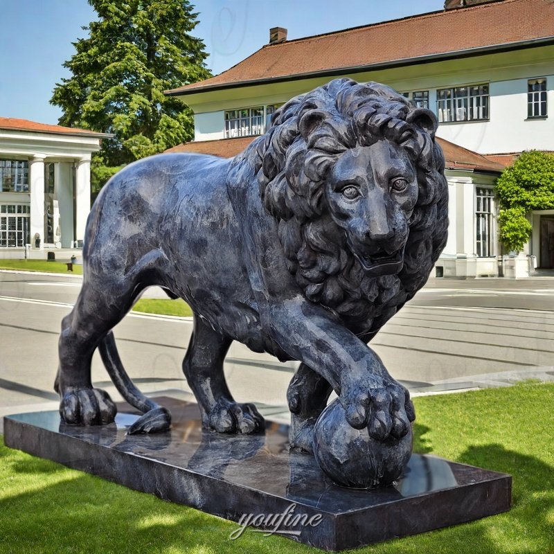 bronze lion with ball statue