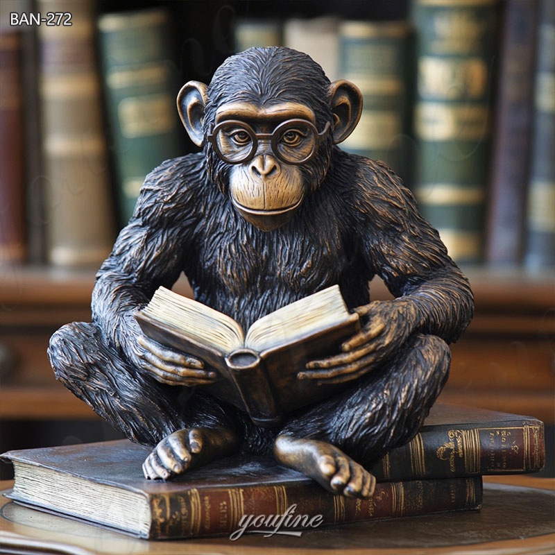 bronze monkey reading a book statue