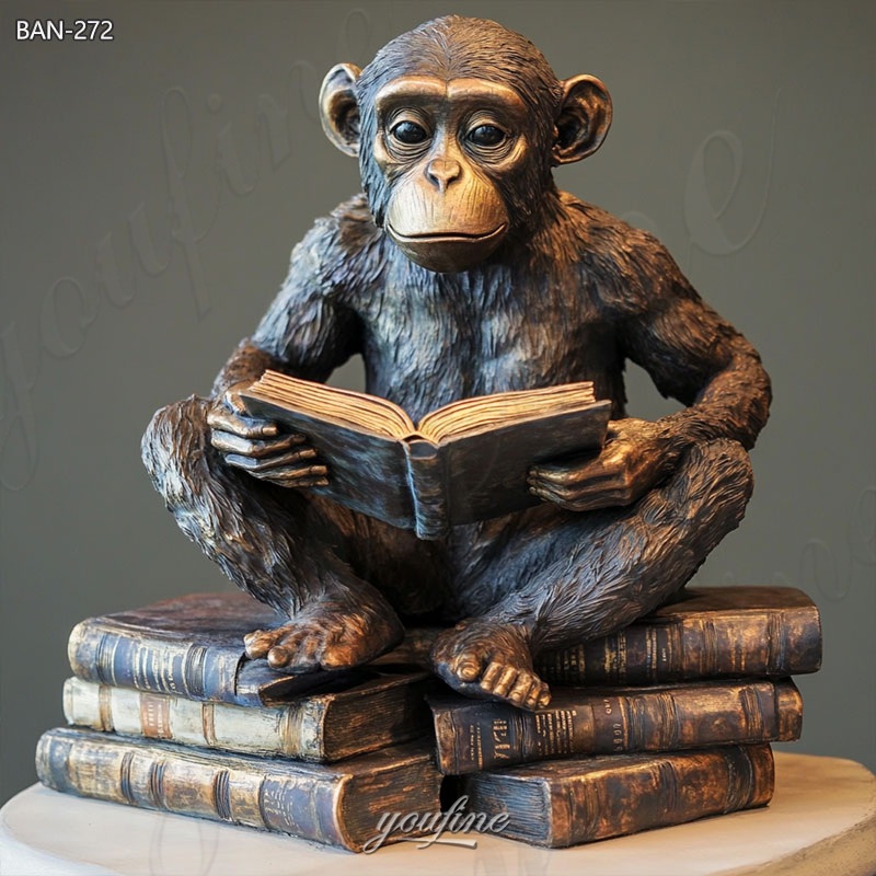 monkey reading a book sculpture