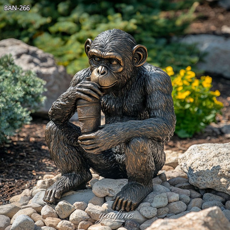 monkey sculpture drinking beer