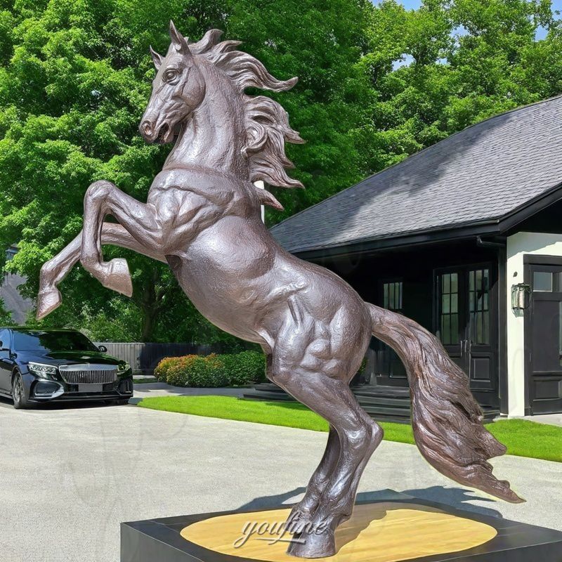 bronze rearing horse in yard