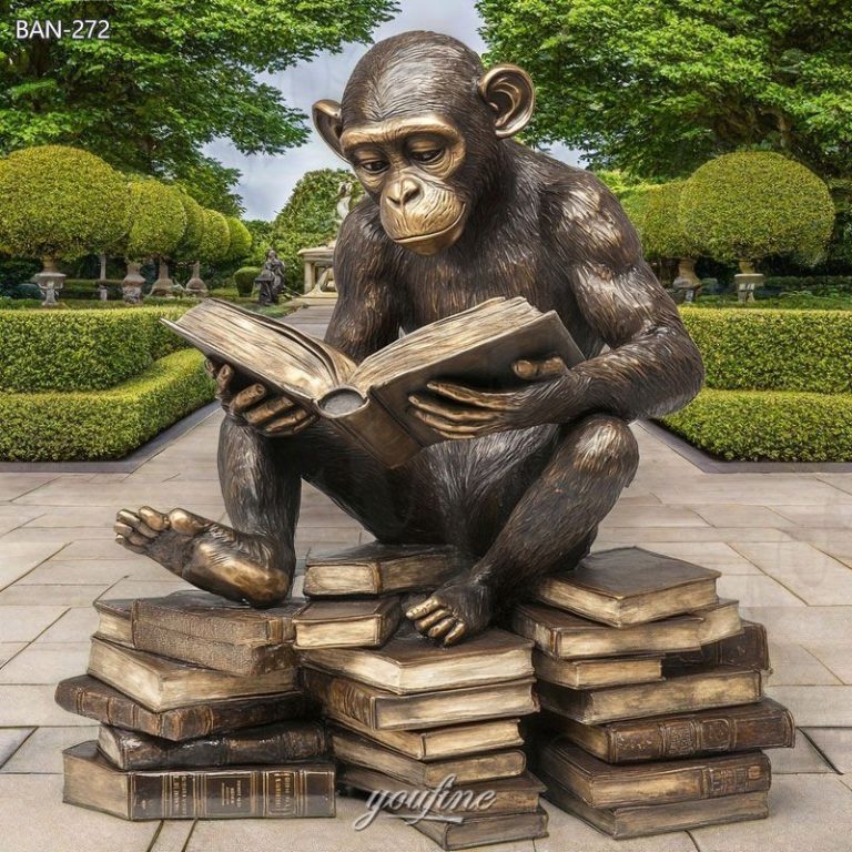 bronze monkey reading book sculpture